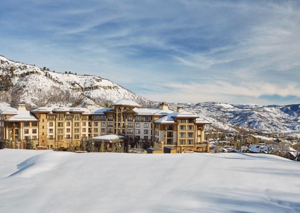 hotel covered in snow with snowmass mountains