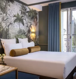 Interior of a hotel room with a street view